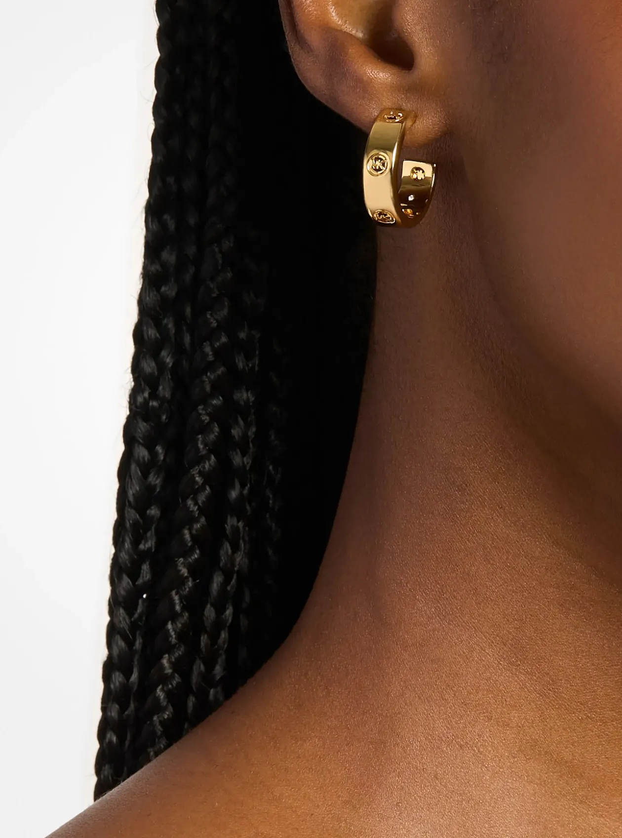 Boucles d'oreilles huggies à logo