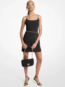 Mini-robe bustier avec ceinture et bretelles chaînes