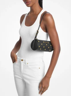 Petite pochette cylindrique Izzy en cuir grainé clouté